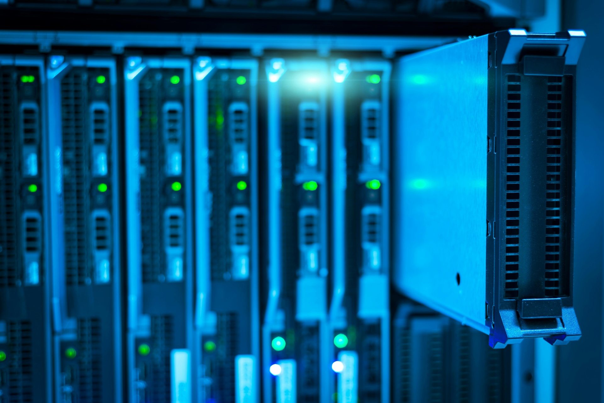 Blade servers glowing inside a data center rack
