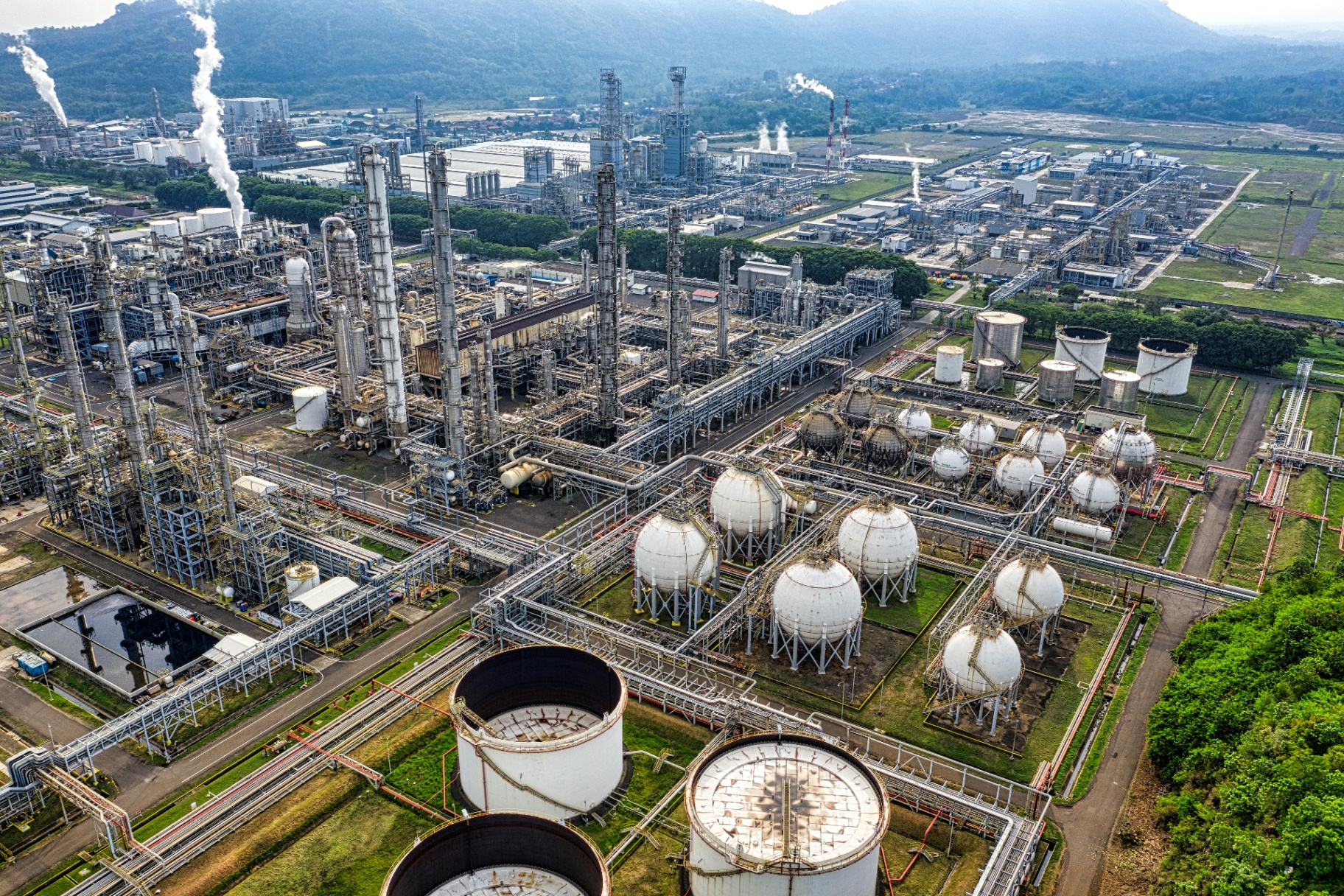 Aerial view of a large refinery and storage tank farm