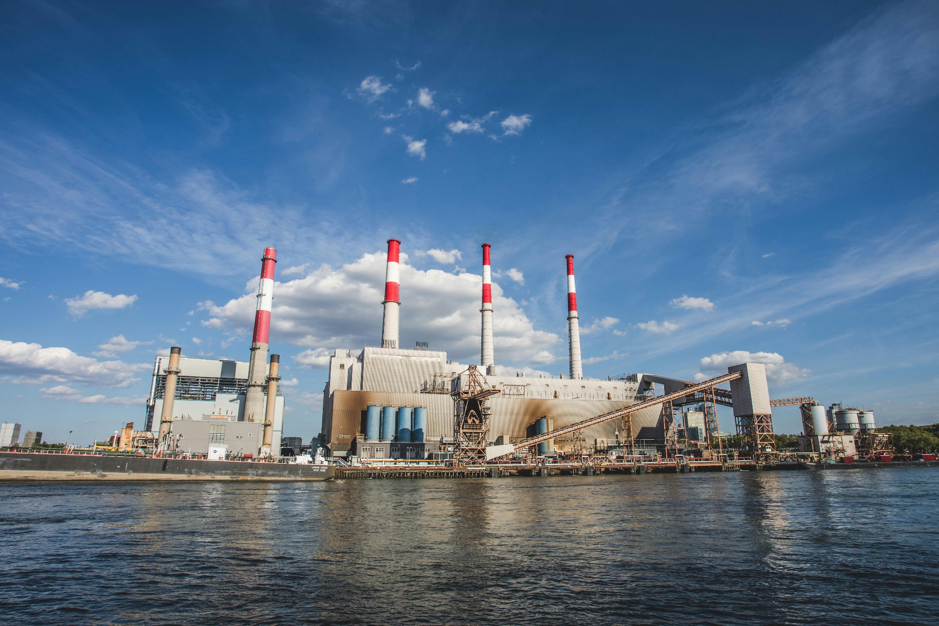 Power generation plant on the waterfront with cooling stacks